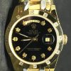 Replica de reloj Rolex Day-Date 04 (37mm) Gold Diamonds (Esfera Negra) Oro rosa y oro blanco (Automático)
